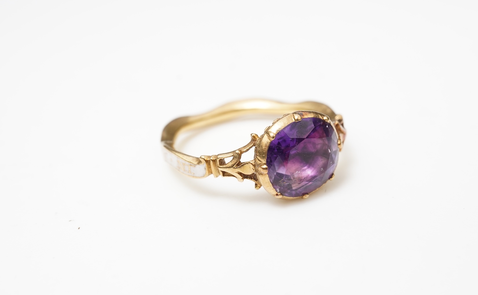 A rare and unusual George III amethyst and enamel mourning ring, late 18th century